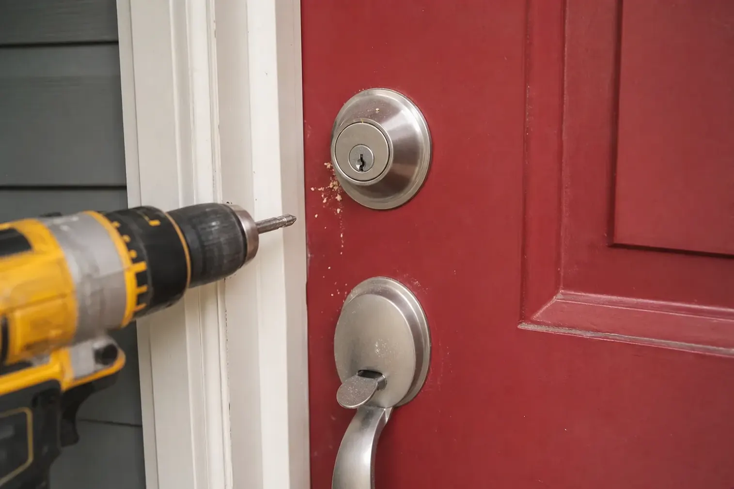 New deadbolt being installed in a front door